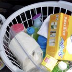laundry baskets with bottled water, food, cleaning supplies, plus other necessities