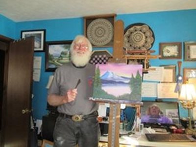 veteran James Nickel participates in the Bob Ross Workshop.