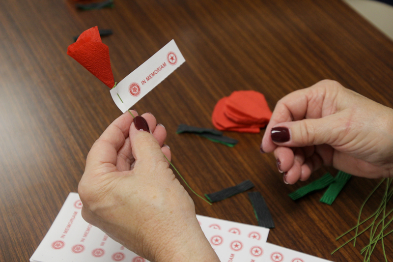 person holding handmade poppy