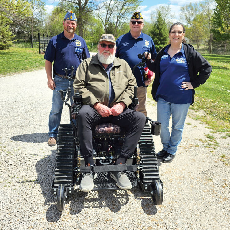 Kansas Legion Family joins forces to fundraise for all-terrain wheelchair presented to veteran