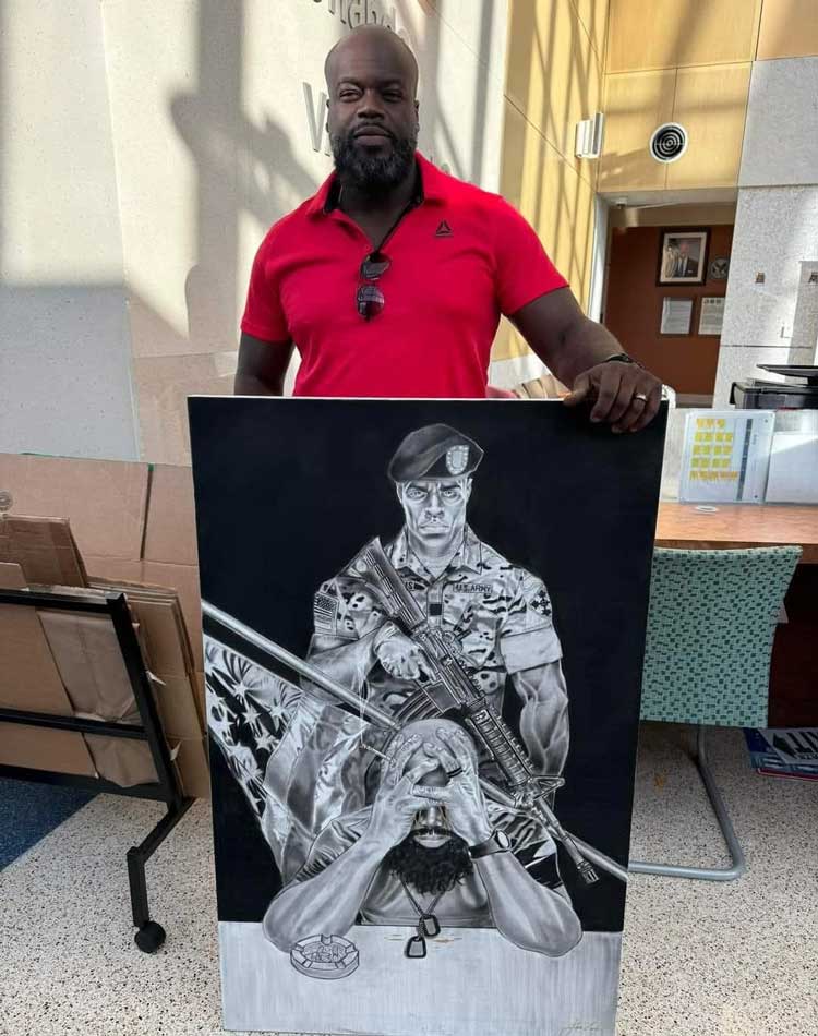 John Lewis with his artwork 