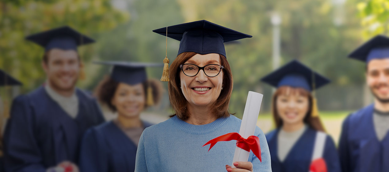 older men and women in graduation cap and gown