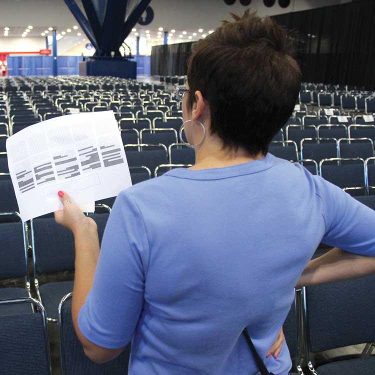 staff looking at map of convention floor